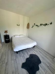 Ένα ή περισσότερα κρεβάτια σε δωμάτιο στο Appartement T3