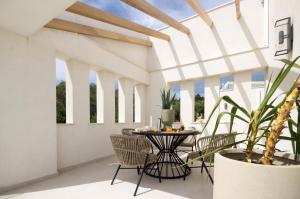 an indoor patio with a table and chairs at Villa Vilielmini Paxos in Gaios