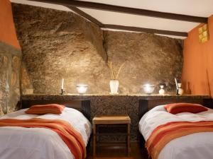 Postel nebo postele na pokoji v ubytování Hotel Mallku Cueva