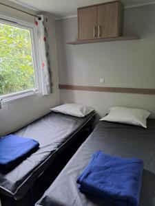 Postel nebo postele na pokoji v ubytování Mobile home