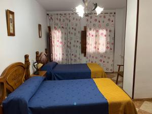 Postel nebo postele na pokoji v ubytování Hostal Moraima