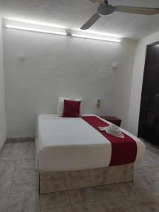 Postel nebo postele na pokoji v ubytování Hotel Margarita