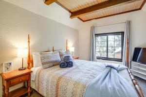 a bedroom with a large bed and a window at Near Lakes and Skiing Cozy Sugarloaf Cabin with Yard in Sugarloaf