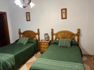 Postel nebo postele na pokoji v ubytování Hostal Moraima