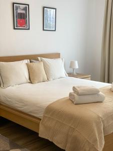 מיטה או מיטות בחדר ב-Alina residance