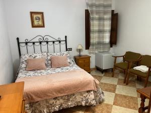 Postel nebo postele na pokoji v ubytování Hostal Moraima
