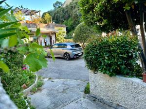 a car parked in the driveway of a house at Villa Bellabé in Nice
