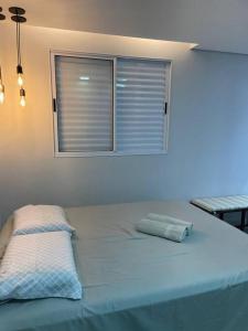 Ένα ή περισσότερα κρεβάτια σε δωμάτιο στο Apartamento Perola