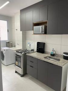 Η κουζίνα ή μικρή κουζίνα στο Apartamento Perola
