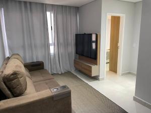 Μια τηλεόραση ή/και κέντρο ψυχαγωγίας στο Apartamento Perola