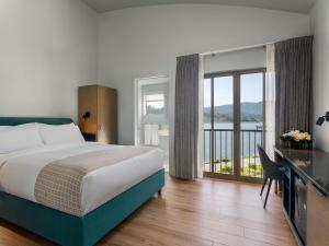 Voodi või voodid majutusasutuse Acqua Hotel toas