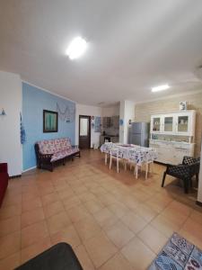 a living room with a couch and a table at Holiday House in Funtana Meiga