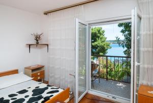 Postel nebo postele na pokoji v ubytování Apartments Marija