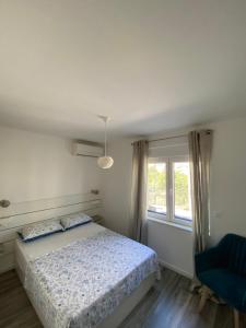 Postel nebo postele na pokoji v ubytování Apartments Bogic