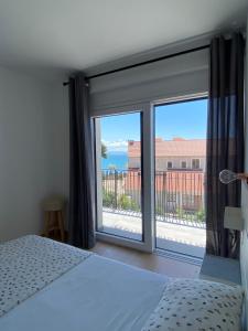 Postel nebo postele na pokoji v ubytování Apartments Bogic