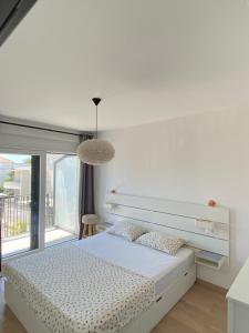 Postel nebo postele na pokoji v ubytování Apartments Bogic