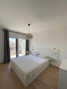 Postel nebo postele na pokoji v ubytování Apartments Bogic