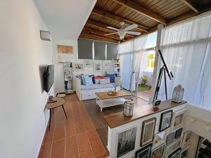 a living room with a couch and a tv at Duplex,near the Beach plus airport in Punta Cana