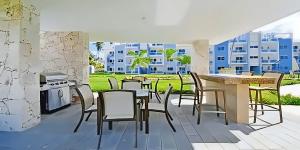 a rendering of a kitchen with a table and chairs at Duplex,near the Beach plus airport in Punta Cana