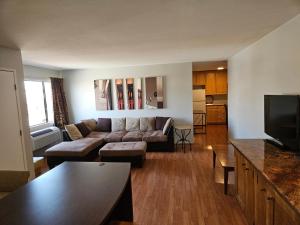 a living room with a couch and a table at Fullerton Inn in Fullerton