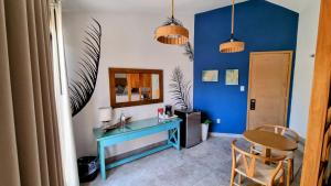 a room with a blue desk and a mirror at Buena Vista Oceanfront & Hot Springs Resort in Buenavista +98 photos