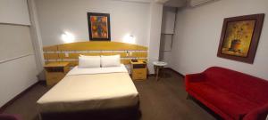 A bed or beds in a room at HOTEL Javier Prado Inn