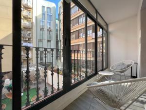 an apartment balcony with a view of a building at Stay U-nique Apartments Rossello in Barcelona