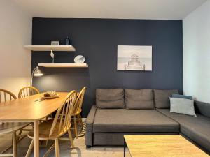 a living room with a couch and a table at Stay U-nique Apartments Rossello in Barcelona