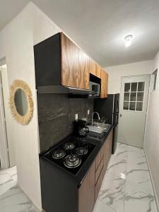 Η κουζίνα ή μικρή κουζίνα στο Departamento en aldea tulum 2BDR