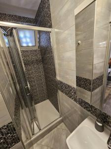 a bathroom with a shower and a sink at Apartments with WiFi Vis - 19923 in Vis +15 photos