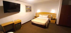 A bed or beds in a room at HOTEL Javier Prado Inn