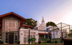 a building with a steeple on top of it at Villa Baywatch, Rumassala in Unawatuna