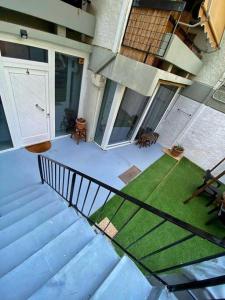 an overhead view of a porch with a lawn and stairs at Sea Urban 4 Varkiza in Vari