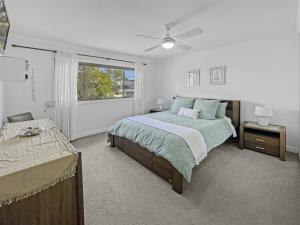 Ένα ή περισσότερα κρεβάτια σε δωμάτιο στο Oasis Coastal Stay