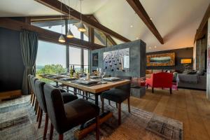 a dining room with a long table and chairs at Akatsuki in Niseko