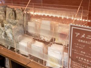 a display of eggs in plastic containers on a counter at Kiso Mikawaya in Kiso