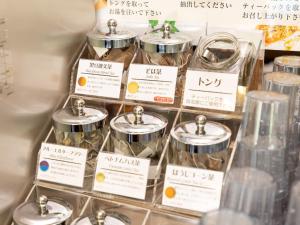 a display of jars of food in a store at Kiso Mikawaya in Kiso