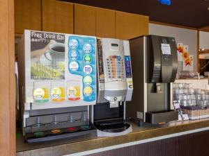 a coffee machine on a counter in a store at Kiso Mikawaya in Kiso