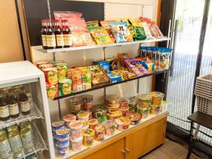 a refrigerator filled with lots of food and drinks at Kiso Mikawaya in Kiso