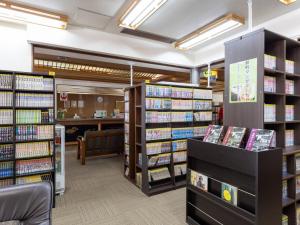 a library with many shelves of books at Kiso Mikawaya in Kiso