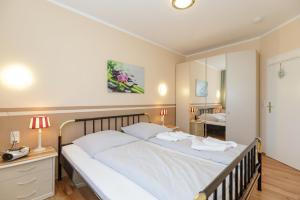 Postel nebo postele na pokoji v ubytování FeWO-Lust-auf-Urlaub