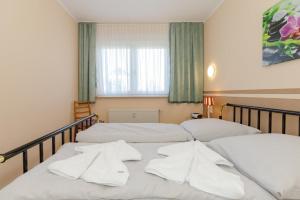 Postel nebo postele na pokoji v ubytování FeWO-Lust-auf-Urlaub