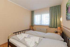 Postel nebo postele na pokoji v ubytování FeWO-Lust-auf-Urlaub