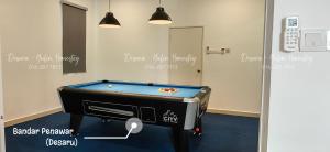 a room with a pool table in a room at Desaru Yulin Homestay 雨林客棧Desaru, Bandar Penawar in Bandar Penawar
