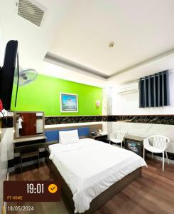 Postel nebo postele na pokoji v ubytování Phúc Khang Hotel Airport