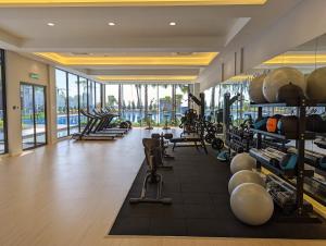 a gym with treadmills and machines in a building at Sunway Grid Loft Suite by Chill Lah Home in Iskandar Puteri