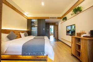 Un ou plusieurs lits dans un hébergement de l'établissement A Mountain Home别有洞天-山居民宿