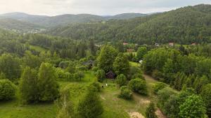 an aerial view of a small village in the mountains at Domek myśliwski w górach in Ujsoły