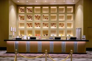 a lobby of a hotel with a reception desk at Resorts World Sentosa - Hotel Michael in Singapore