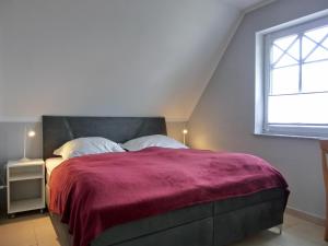 Postel nebo postele na pokoji v ubytování Ferienhaus FH T 1b